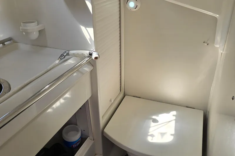 Slide: The Image of Bathroom interior of 1991 Beneteau 35.5 S5 sailboat, featuring compact design and fixtures. - 16