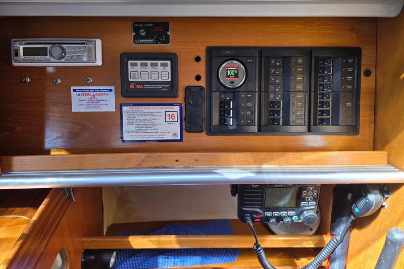 Slide: The Image of Control panel of a 1991 Beneteau 35.5 S5 sailboat with radio and electrical switches. - 17