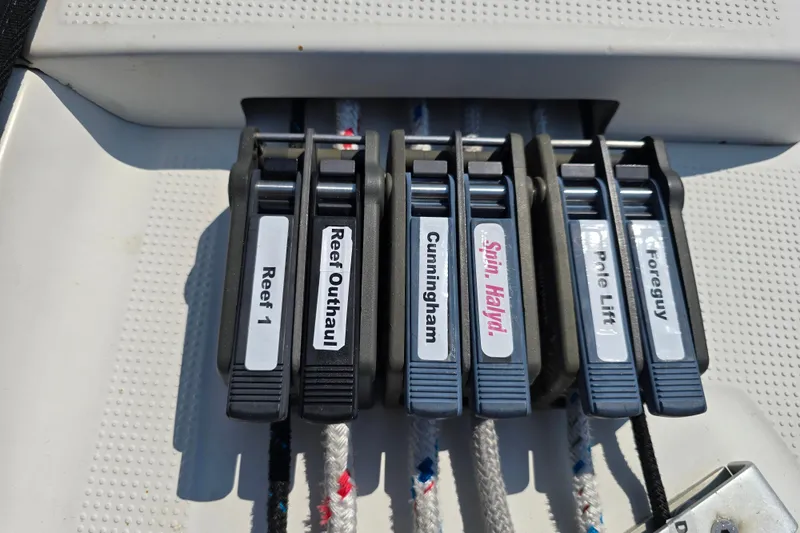 Slide: The Image of Sailing controls on a 1991 Beneteau 35.5 S5, labeled for various functions. - 21