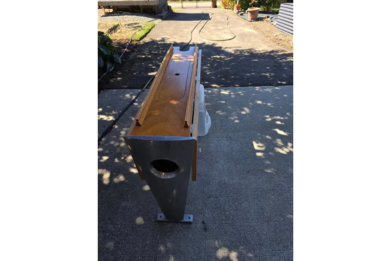 Slide: The Image of Wooden tiller for 1991 Beneteau 35.5 S5 sailboat on concrete surface. - 6
