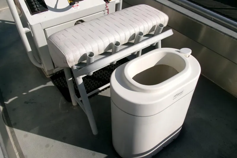 Slide: The Image of Boat interior with seating and storage, Pacific Boats 2025 V, 2003 model. - 14