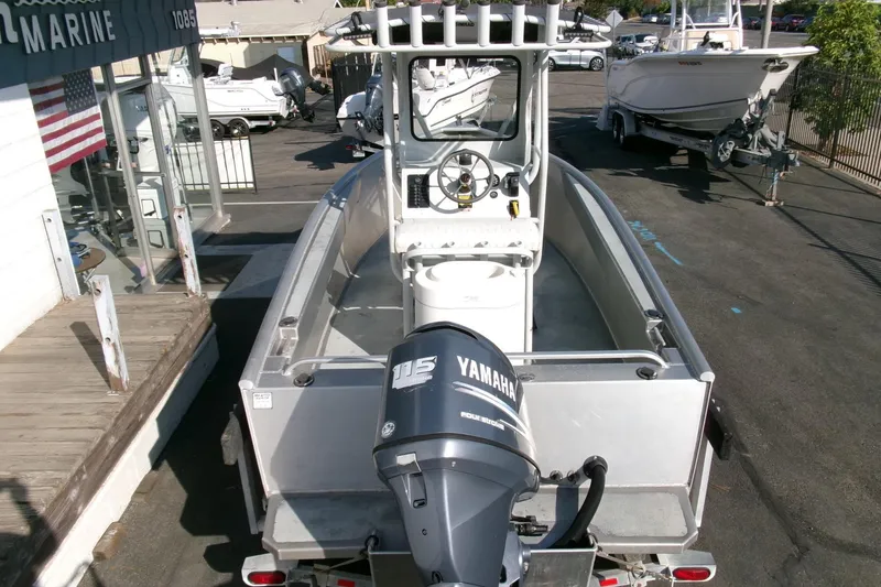 Slide: The Image of 2003 Pacific Boats 2025 V with Yamaha motor, docked at a marina. - 18