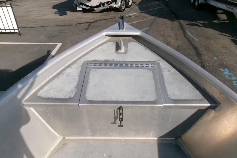 Slide: The Image of Bow view of a 2003 Pacific Boats 2025 V, showcasing deck and storage area. - 5