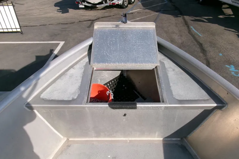 Slide: The Image of 2003 Pacific Boats 2025 V bow with open hatch and orange bucket inside. - 6