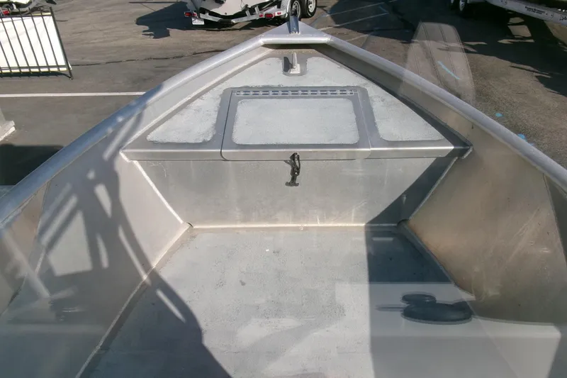 Slide: The Image of Aluminum interior of 2003 Pacific Boats 2025 V, showing storage compartment and deck. - 7