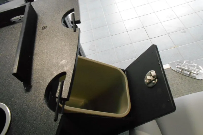 Slide: The Image of Trash compartment on 2025 Crest Classic Fish 220 boat. - 12