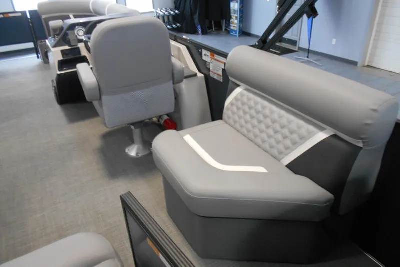 Slide: The Image of Interior of 2025 Crest Classic Fish 220 boat with gray seating and modern design. - 14