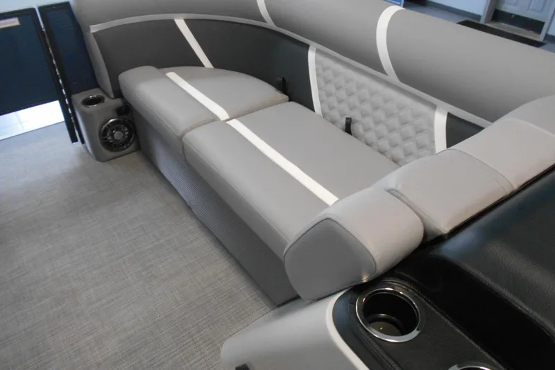 Slide: The Image of 2025 Crest Classic Fish 220 boat interior with gray seating and cup holders. - 21
