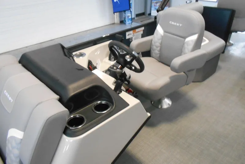 Slide: The Image of Interior of 2025 Crest Classic Fish 220 boat with steering console and seating. - 25
