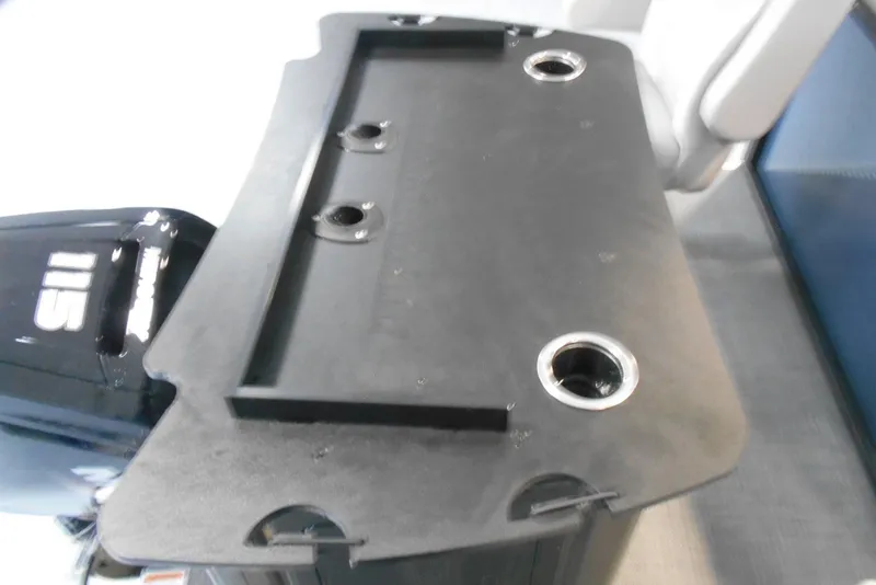 Slide: The Image of 2025 Crest Classic Fish 220 boat with motor and fishing rod holders. - 8