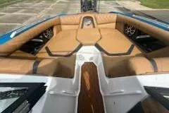 Slide: The Image of 2017 Tigé RZX2 boat interior with tan leather seating and sleek design. - 10