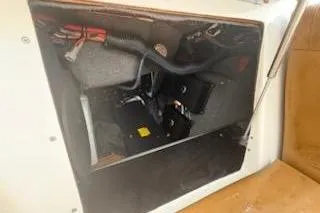 Slide: The Image of 2017 Tigé RZX2 boat interior compartment with visible wiring and components. - 14