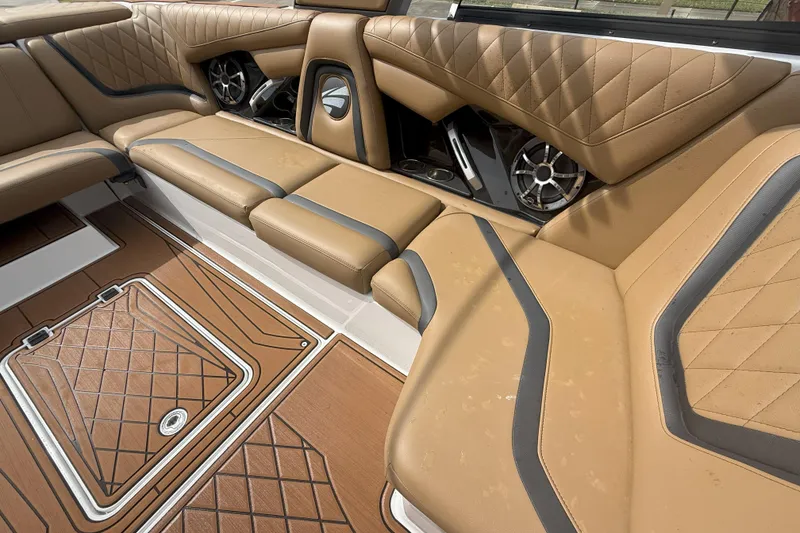 Slide: The Image of 2017 Tigé RZX2 boat interior with tan leather seating and stylish speaker system. - 40