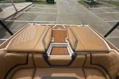Slide: The Image of 2017 Tigé RZX2 boat interior with tan leather seating and stylish design. - 6