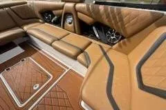 Slide: The Image of Luxurious interior of 2017 Tigé RZX2 boat with tan leather seating and stylish design. - 7