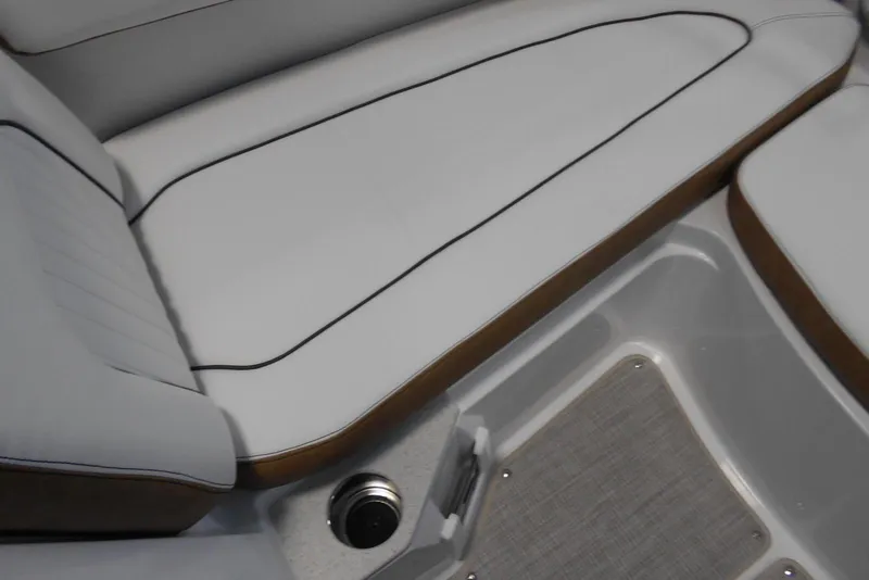 Slide: The Image of 2025 Stingray 201 DC boat interior with sleek white seating and modern design. - 14