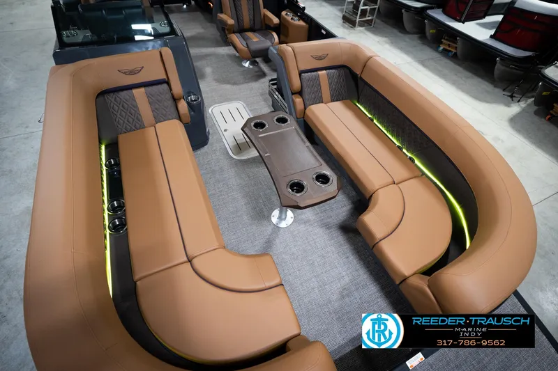 Slide: The Image of Luxurious interior of 2026 Bennington 22 MFB pontoon boat with tan seating and cup holders. - 12