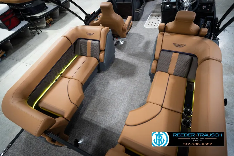 Slide: The Image of Luxurious interior of 2026 Bennington 22 MFB pontoon boat with tan seating and cup holders. - 13