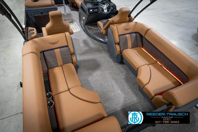 Slide: The Image of Luxurious interior of 2026 Bennington 22 MFB pontoon boat with tan seating and LED lighting. - 14