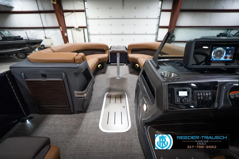 Slide: The Image of Luxurious interior of 2026 Bennington 22 MFB boat with plush seating and ambient lighting. - 19