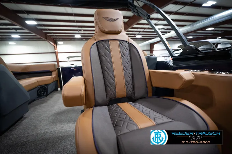Slide: The Image of Luxurious seating in the 2026 Bennington 22 MFB boat, featuring elegant tan and gray upholstery. - 24