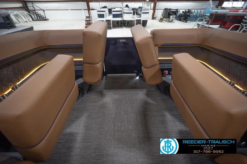 Slide: The Image of 2026 Bennington 22 MFB boat interior with tan seating and modern design. - 26