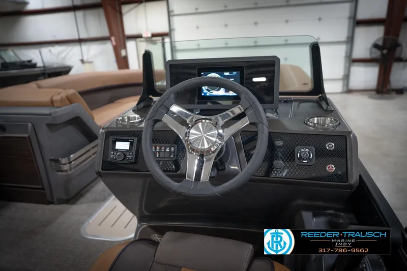 Slide: The Image of 2026 Bennington 22 MFB boat interior with foldable table and storage compartment. - 30