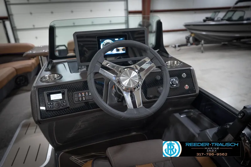 Slide: The Image of 2026 Bennington 22 MFB boat dashboard with steering wheel and control panel. - 31