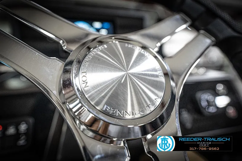 Slide: The Image of Steering console of 2026 Bennington 22 MFB boat with modern controls and display. - 32