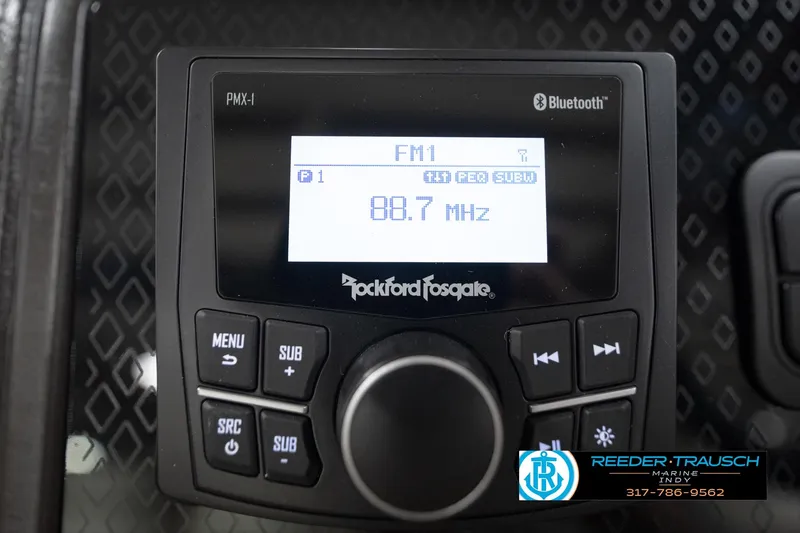 Slide: The Image of Close-up of 2026 Bennington 22 MFB steering wheel with Reeder-Trausch Marine logo. - 33