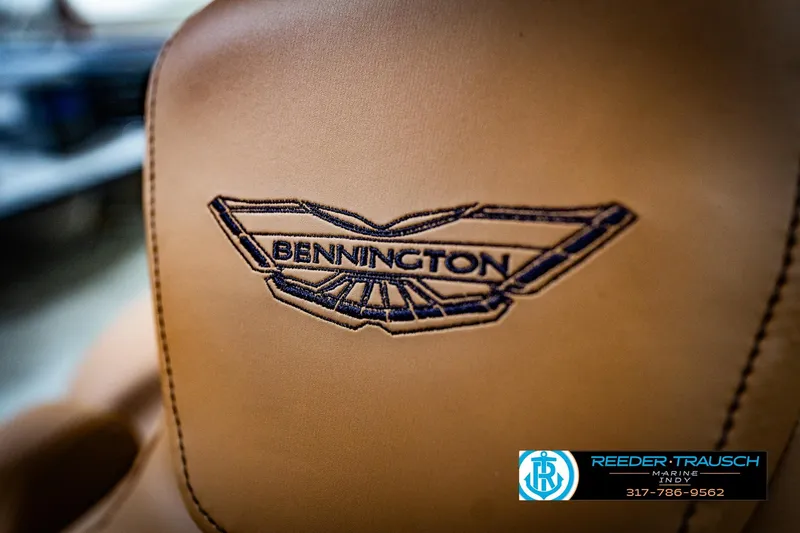 Slide: The Image of Luxurious seating in 2026 Bennington 22 MFB boat, showcased indoors at Reeder-Trausch Marine. - 43