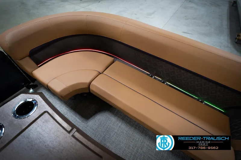 Slide: The Image of Luxurious seating on 2026 Bennington 22 MFB boat with elegant tan upholstery and ambient lighting. - 45