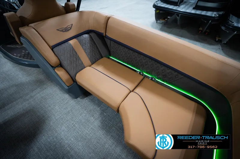 Slide: The Image of Luxurious seating on 2026 Bennington 22 MFB boat with ambient lighting and cup holders. - 46