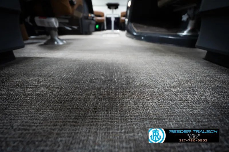 Slide: The Image of Luxurious seating in 2026 Bennington 22 MFB boat with elegant design and ambient lighting. - 47