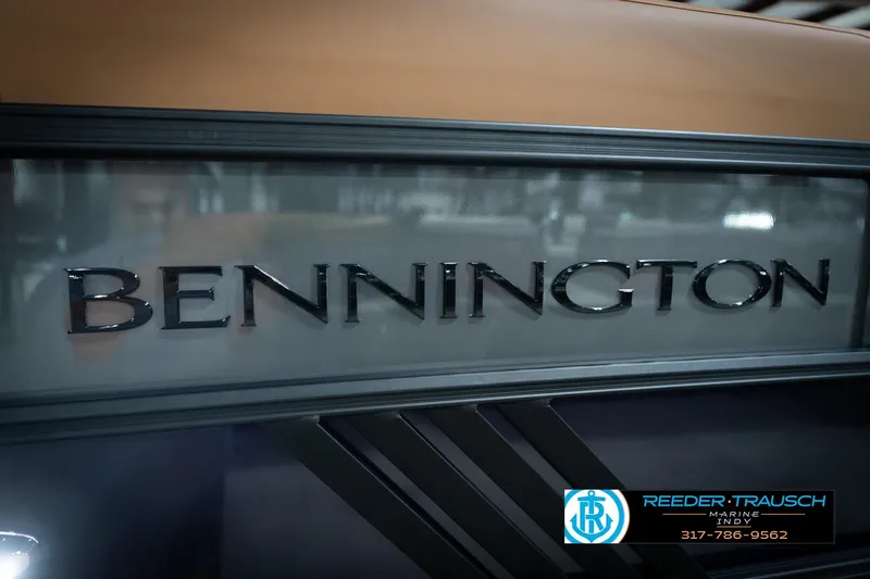 Slide: The Image of 2026 Bennington 22 MFB logo on display at Reeder-Trausch Marine showroom. - 49