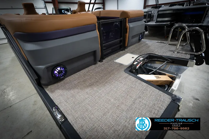 Slide: The Image of 2026 Bennington 22 MFB boat with M24 emblem, Reeder-Trausch Marine logo visible. - 51