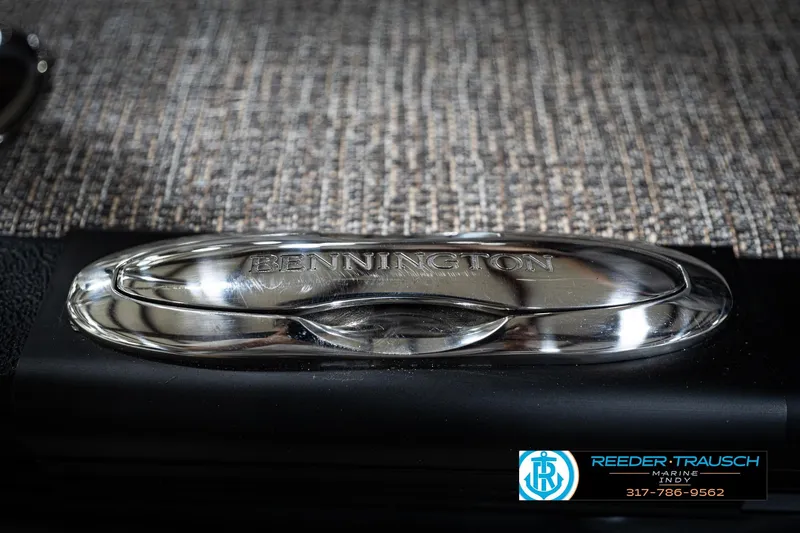 Slide: The Image of 2026 Bennington 22 MFB boat interior with storage compartment and speaker. - 52