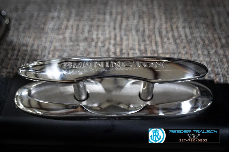 Slide: The Image of 2026 Bennington 22 MFB boat emblem on textured surface, Reeder Trausch Marine logo visible. - 53