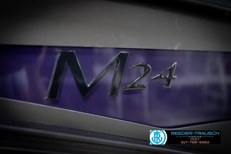 Slide: The Image of 2026 Bennington 22 MFB boat with M24 emblem, Reeder-Trausch Marine logo visible. - 57