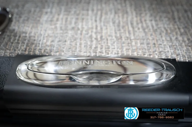 Slide: The Image of 2026 Bennington 22 MFB boat emblem on textured surface, Reeder Trausch Marine logo visible. - 59