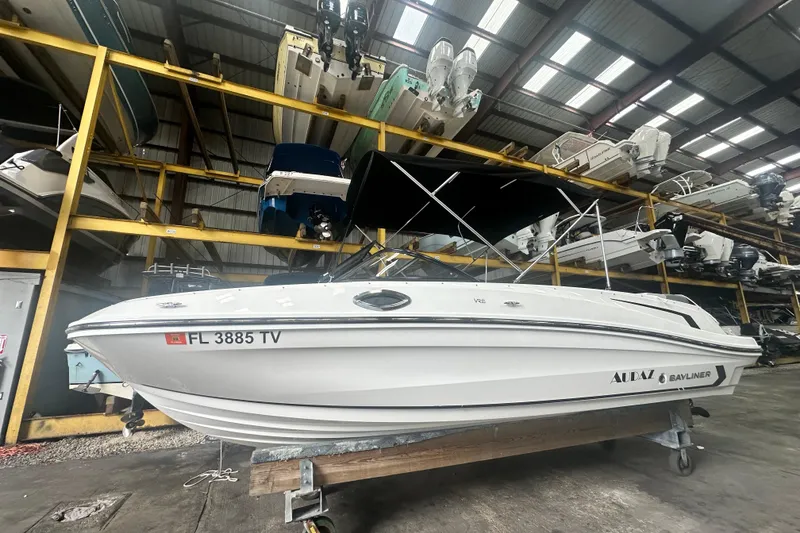 The Image of 2024 Bayliner VR6 Bowrider OB in storage, showcasing sleek design and modern features. - 0