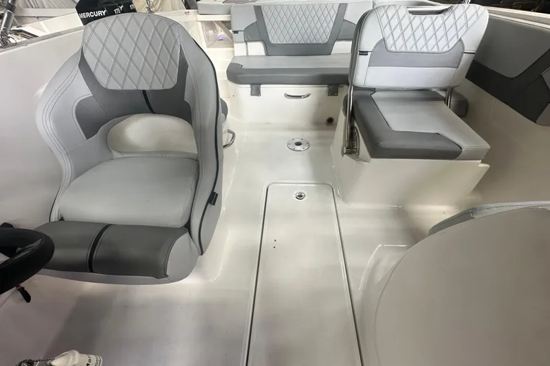 Slide: The Image of 2024 Bayliner VR6 Bowrider OB interior with gray seating and modern design. - 19
