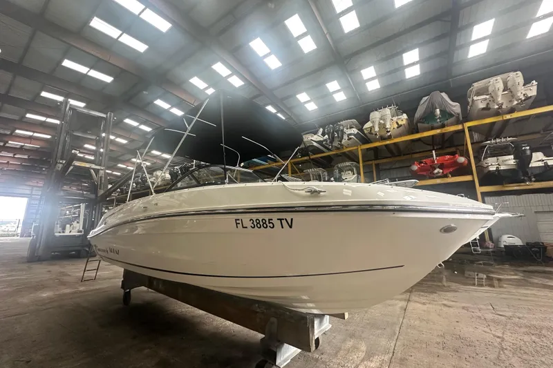 Slide: The Image of 2024 Bayliner VR6 Bowrider OB in storage, showcasing sleek design and modern features. - 2