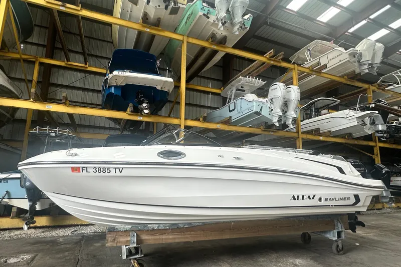 Slide: The Image of 2024 Bayliner VR6 Bowrider OB in storage, surrounded by other boats. - 5
