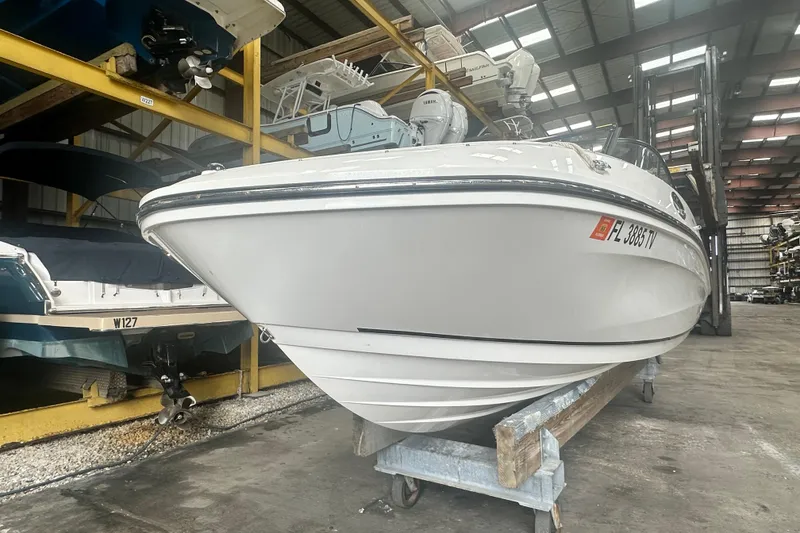 Slide: The Image of 2024 Bayliner VR6 Bowrider OB in storage, showcasing sleek design and modern features. - 7