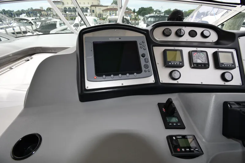 Slide: The Image of Dashboard of 2007 Cruisers Yachts 455 Express Motoryacht with navigation and control instruments. - 12