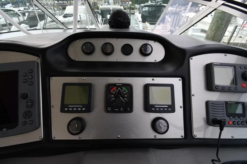 Slide: The Image of Dashboard of 2007 Cruisers Yachts 455 Express Motoryacht with navigation instruments and controls. - 13