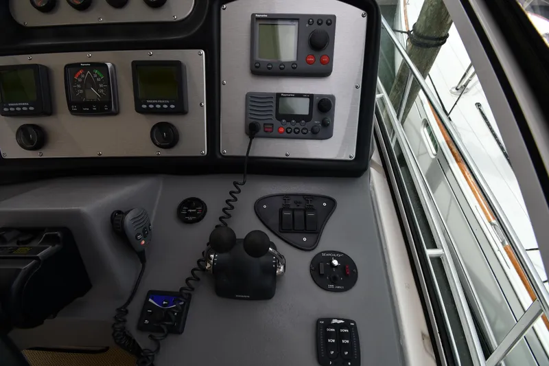 Slide: The Image of Control panel of 2007 Cruisers Yachts 455 Express Motoryacht with navigation instruments. - 14
