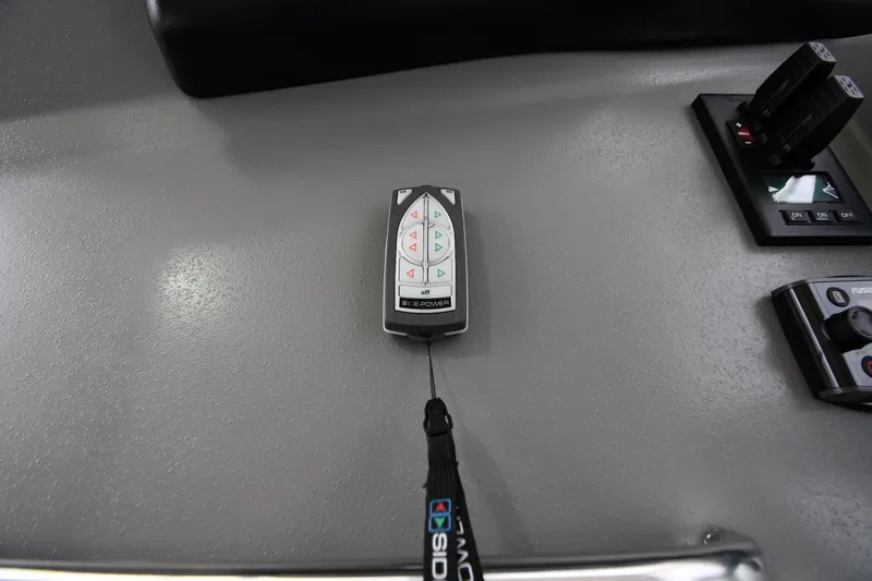 Slide: The Image of Control panel of 2007 Cruisers Yachts 455 Express Motoryacht with remote and switches. - 16