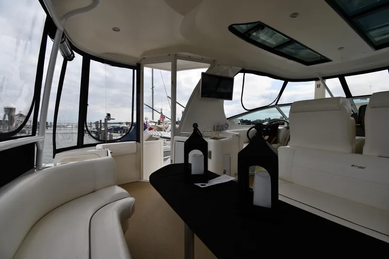 Slide: The Image of Luxurious interior of 2007 Cruisers Yachts 455 Express Motoryacht with elegant seating and panoramic windows. - 19